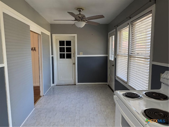 kitchen featuring ceiling fan and white electric stove