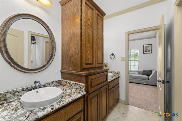 bathroom featuring tile patterned flooring, vanity, and ornamental molding