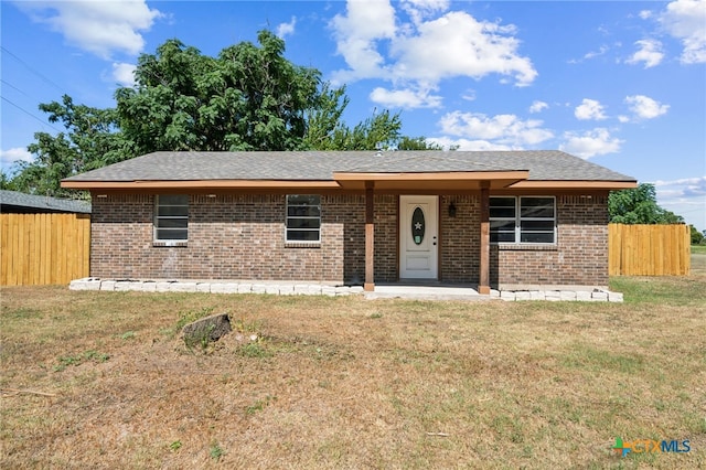 ranch-style house with a front yard