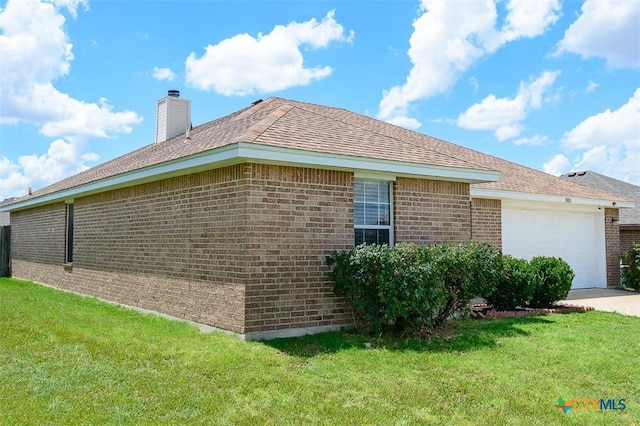 3903 Kevin Shaw Dr, Killeen, TX 76549 - view of property exterior featuring brick siding, a lawn, an attached garage, a chimney, and concrete driveway