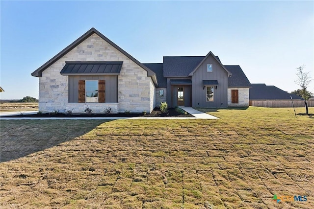 modern farmhouse with a front lawn