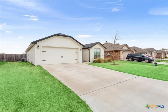 2619 Settlers Oak Dr, Belton, TX 76513 - single story home featuring central air condition unit, fence, driveway, a front lawn, and a garage