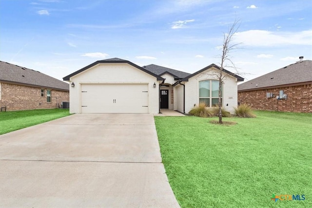 2619 Settlers Oak Dr, Belton, TX 76513 - view of front of property with a front lawn, driveway, a garage, and brick siding