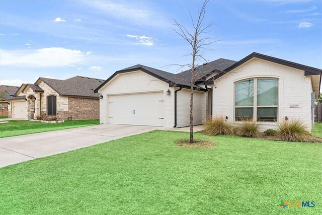2619 Settlers Oak Dr, Belton, TX 76513 - ranch-style house with an attached garage, brick siding, concrete driveway, and a front yard