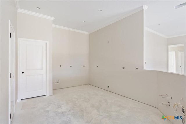 empty room with carpet flooring and ornamental molding