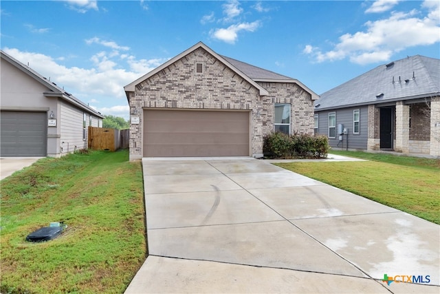 view of front of house featuring a garage and a front yard