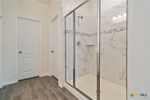 bathroom featuring an enclosed shower