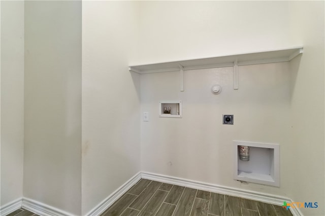 laundry area with washer hookup, hookup for a gas dryer, electric dryer hookup, and dark hardwood / wood-style flooring