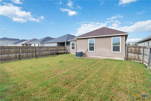 back of house with a lawn and a patio area