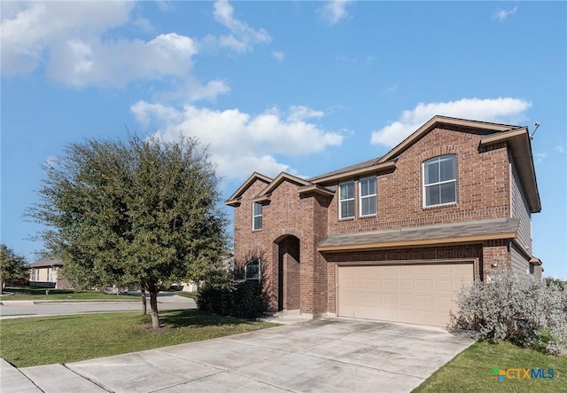 view of front of home featuring a garage and a front yard