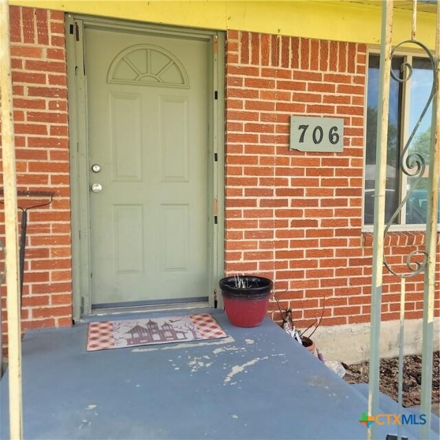 706 S 1st St, Copperas Cove, TX 76522 - doorway to property with brick siding