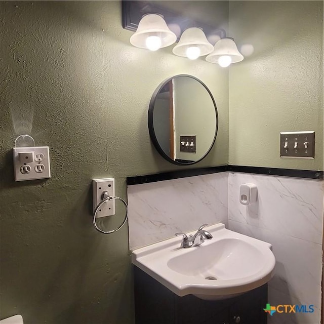 706 S 1st St, Copperas Cove, TX 76522 - bathroom with vanity and tile walls