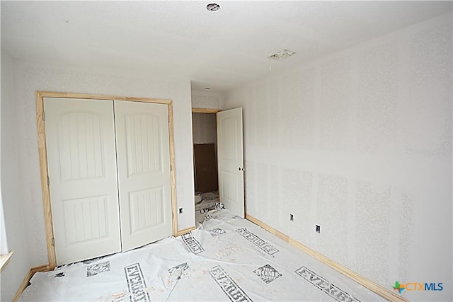 439 Deer Crk, Spring Branch, TX 78070 - unfurnished bedroom with a closet and baseboards
