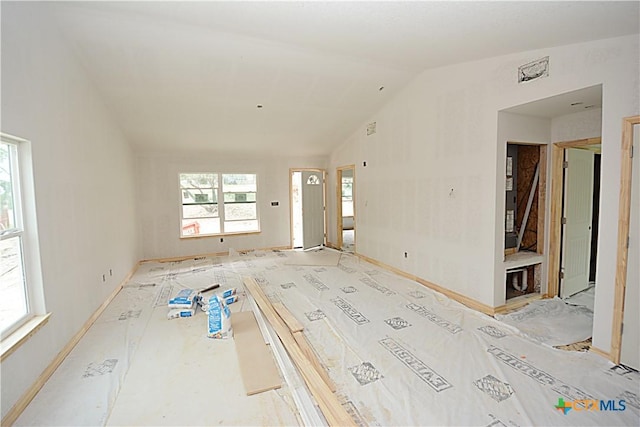 439 Deer Crk, Spring Branch, TX 78070 - unfurnished living room with lofted ceiling and baseboards