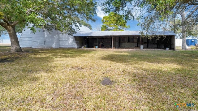 view of outbuilding with a lawn