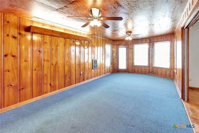 spare room with ceiling fan and carpet floors