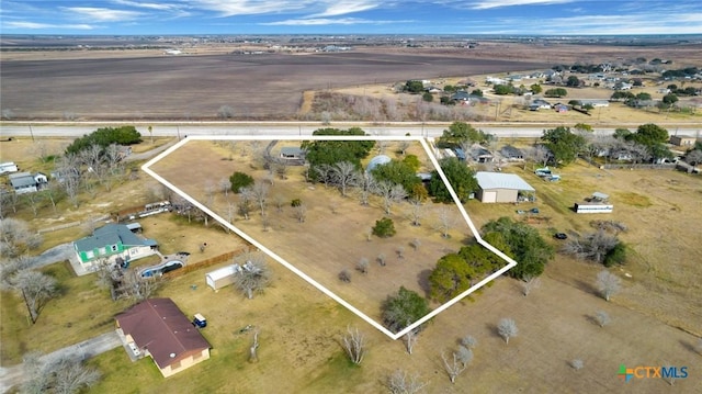 birds eye view of property featuring a rural view