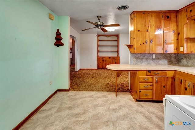 kitchen featuring tasteful backsplash and ceiling fan