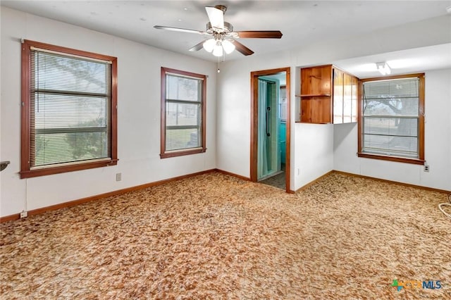 unfurnished bedroom featuring ceiling fan and light colored carpet