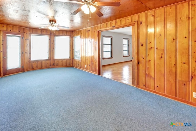 carpeted empty room with ceiling fan