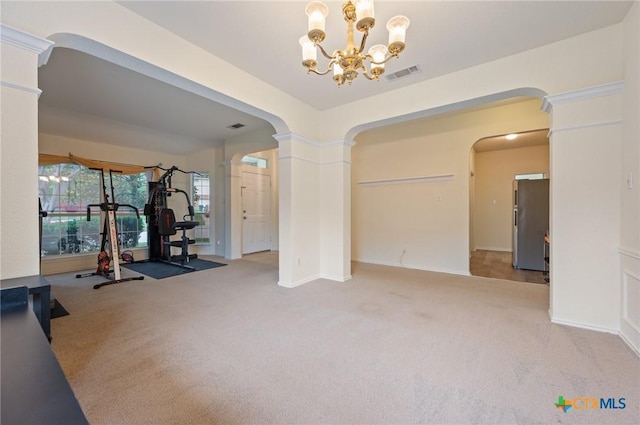 104 Missouri Dr, Harker Heights, TX 76548 - exercise area featuring arched walkways, carpet flooring, a chandelier, and decorative columns