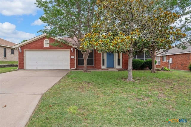 104 Missouri Dr, Harker Heights, TX 76548 - view of front of house featuring a garage, concrete driveway, a front yard, and brick siding