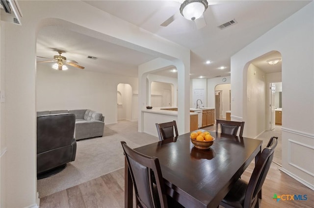 104 Missouri Dr, Harker Heights, TX 76548 - dining space featuring arched walkways, a ceiling fan, light wood-type flooring, and recessed lighting