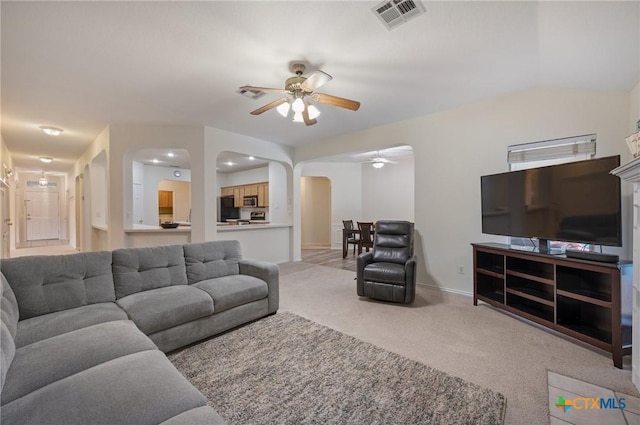 104 Missouri Dr, Harker Heights, TX 76548 - carpeted living area with arched walkways, ceiling fan, and baseboards