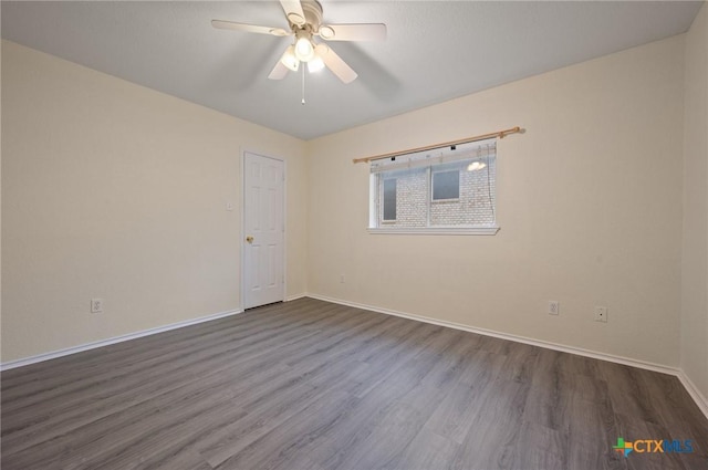 104 Missouri Dr, Harker Heights, TX 76548 - unfurnished room with dark wood-type flooring, baseboards, and a ceiling fan