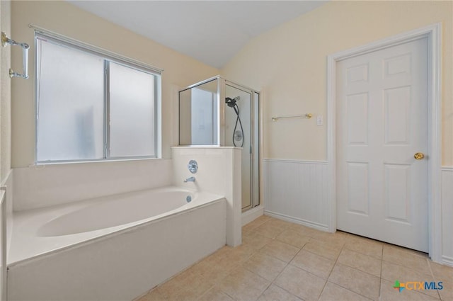 104 Missouri Dr, Harker Heights, TX 76548 - bathroom featuring a bath, a stall shower, a wainscoted wall, and tile patterned flooring
