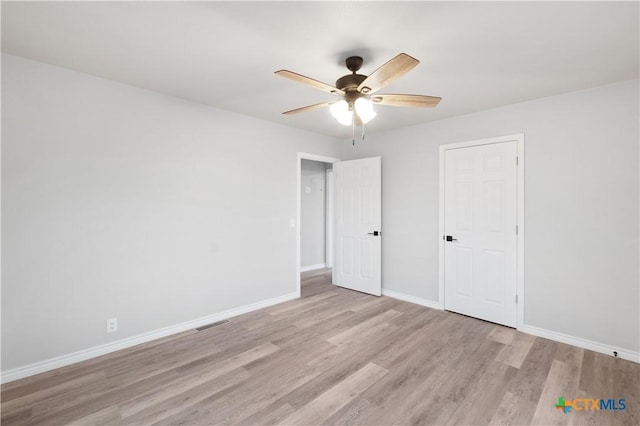 unfurnished bedroom featuring light hardwood / wood-style flooring and ceiling fan