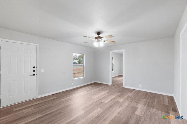 unfurnished room featuring ceiling fan and light hardwood / wood-style floors