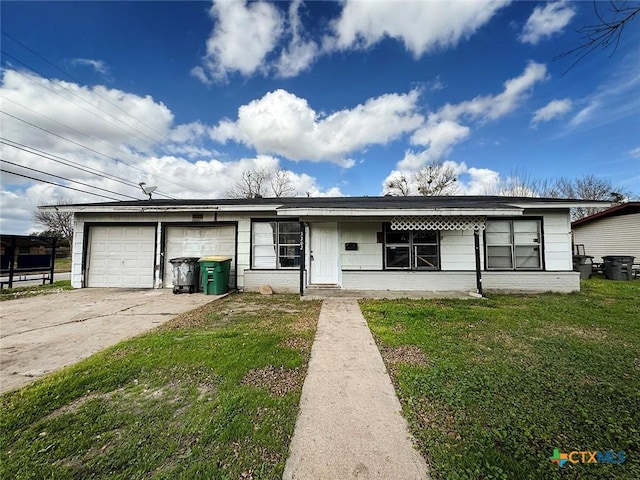 ranch-style home featuring a garage and a front yard