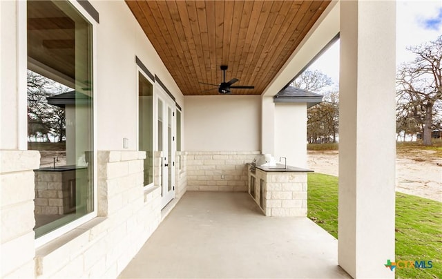 view of patio featuring ceiling fan