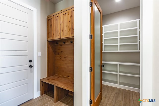 mudroom with light hardwood / wood-style flooring