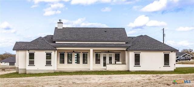 rear view of property with french doors and ceiling fan