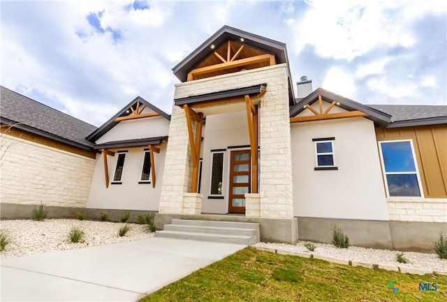 104 Hondo Vis, La Vernia, TX 78121 - modern home with roof with shingles and stone siding