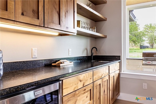 104 Hondo Vis, La Vernia, TX 78121 - kitchen featuring wine cooler, dark countertops, and open shelves