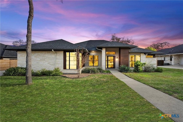 view of front of home with a lawn