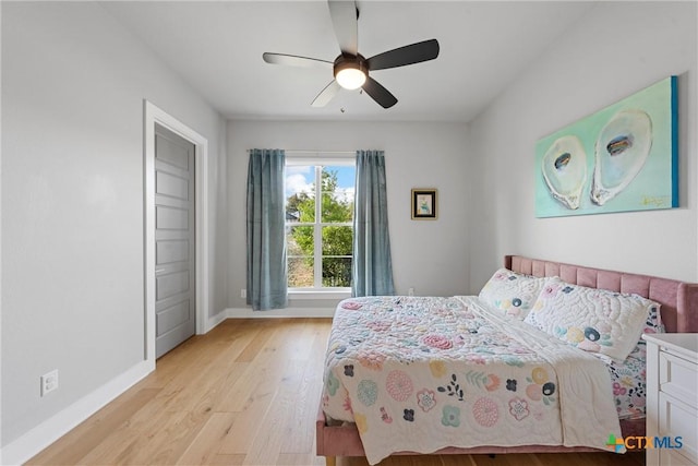 bedroom featuring ceiling fan and light wood-type flooring