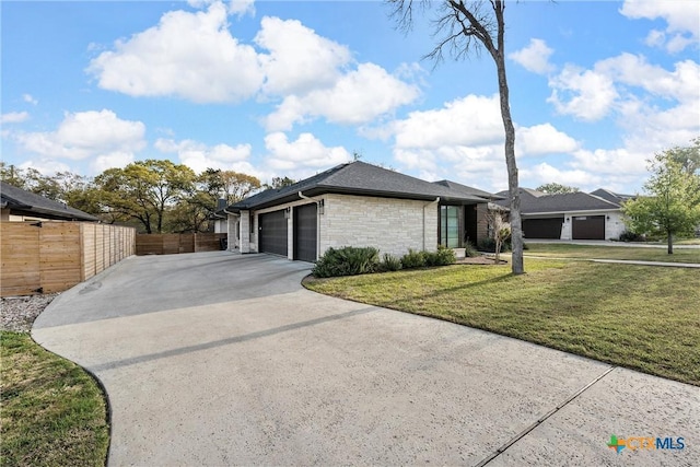 single story home with a front lawn and a garage