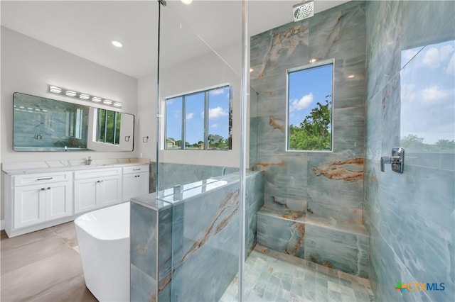 6846 Spring Branch Rd, Spring Branch, TX 78070 - bathroom with a marble finish shower, plenty of natural light, vanity, and a freestanding tub