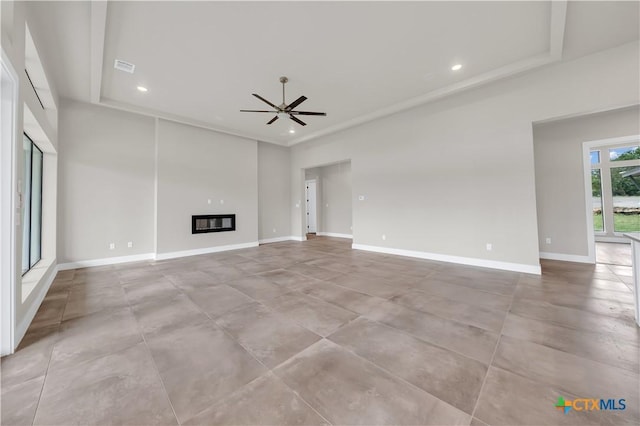 6846 Spring Branch Rd, Spring Branch, TX 78070 - unfurnished living room with a ceiling fan, recessed lighting, a glass covered fireplace, concrete floors, and baseboards