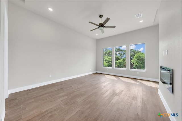 6846 Spring Branch Rd, Spring Branch, TX 78070 - unfurnished living room with wood finished floors, a ceiling fan, baseboards, and recessed lighting