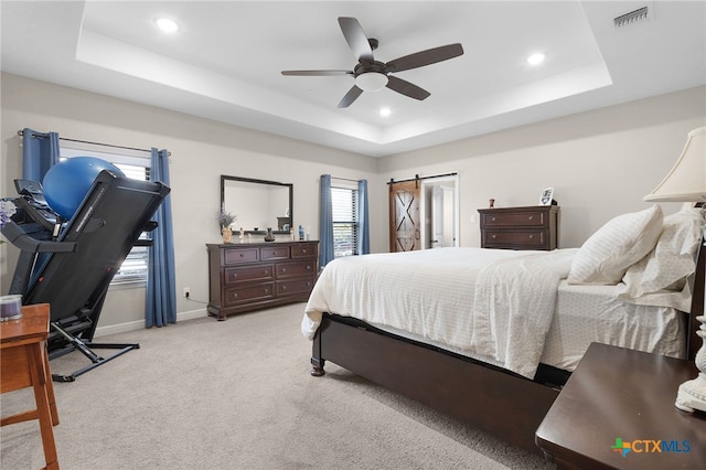 bedroom with recessed lighting, baseboards, a raised ceiling, and light carpet