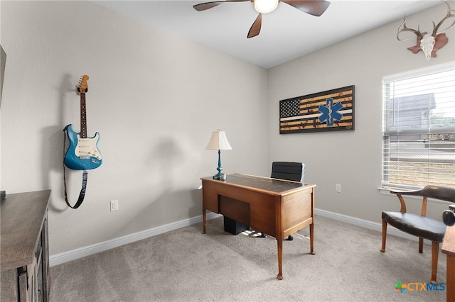 office area featuring baseboards, carpet floors, and ceiling fan