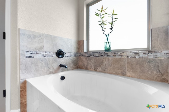 bathroom featuring a garden tub