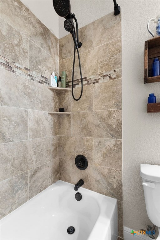 bathroom featuring toilet and bathing tub / shower combination