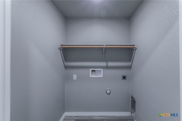 washroom featuring electric dryer hookup, gas dryer hookup, dark hardwood / wood-style flooring, and hookup for a washing machine