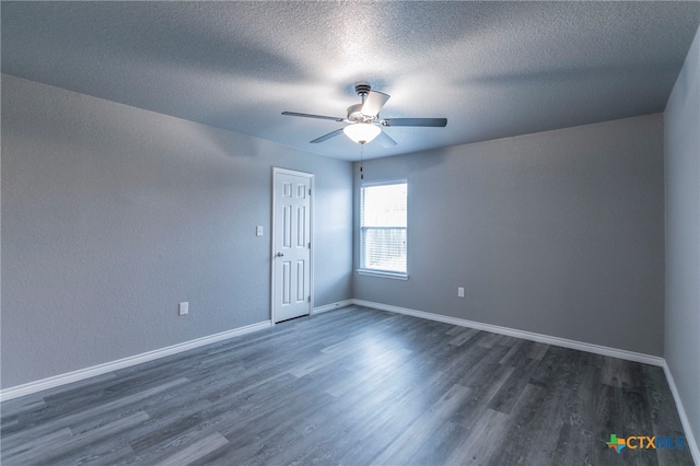 unfurnished room featuring ceiling fan, dark hardwood / wood-style flooring, and a textured ceiling